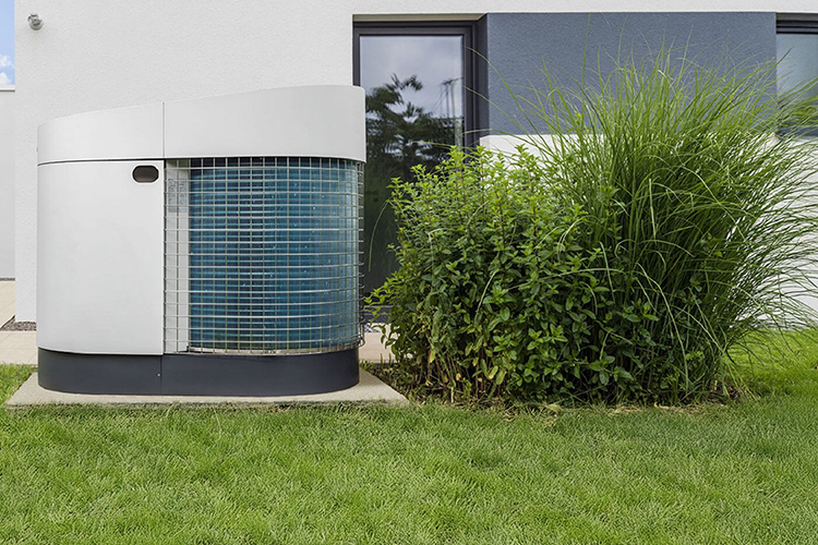 Heat pump in the garden of a modern detached houses